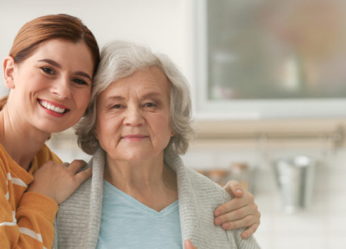 An elderly woman and her caretaker