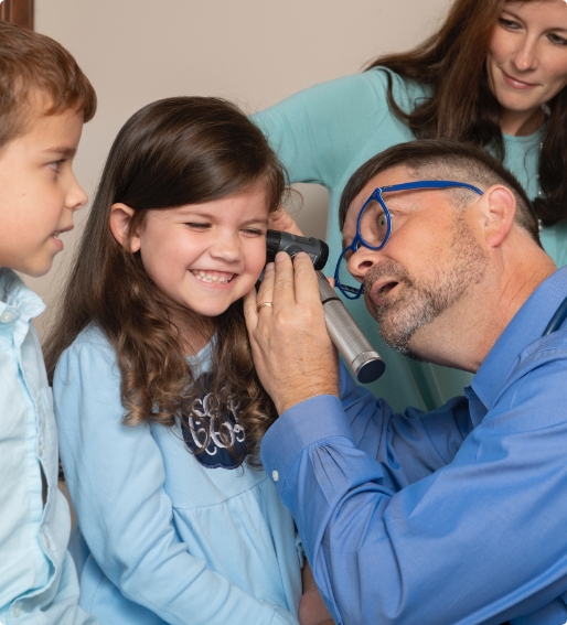girl getting her ear checked by Doctor