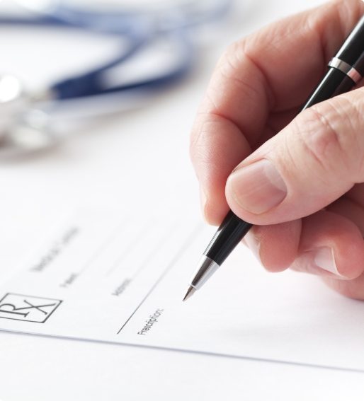 hand writing a prescription