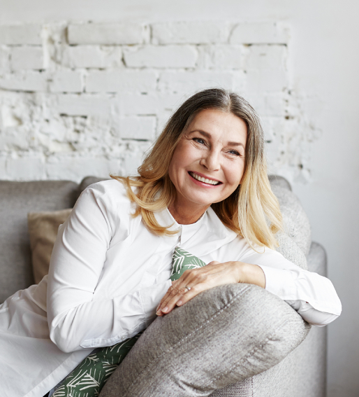 Woman leaning on a couch arm